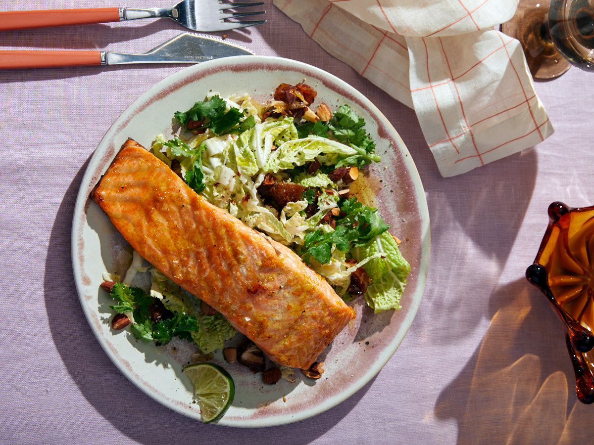 Cumin, Ginger, and Citrus Roasted Salmon with Cabbage, Dates, and Creamy Tahini Dressing